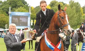  ??  ?? patrick print gives Guy Landau and supreme horse Finn McCool II the Winston Churchill Cup