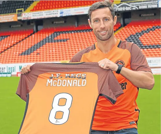  ?? Picture: Dundee United. ?? Former Motherwell and Celtic striker Scott McDonald is paraded at Tannadice after signing a one-year contract.