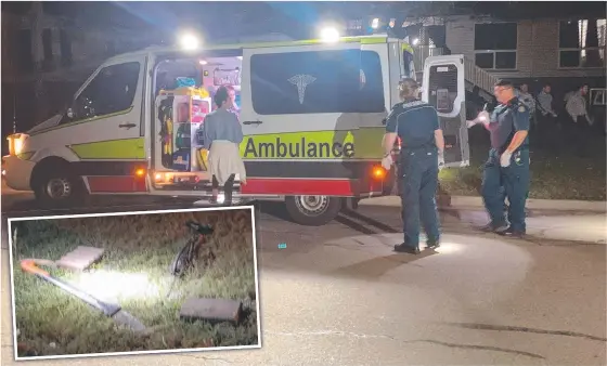  ??  ?? Ambulance officers treated injured people, while Townsville Police seized weapons after a violent disturbanc­e in Vincent on Sunday night.