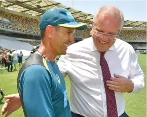  ?? PM Scott Morrison and Australian Coach Justin Langer. ??