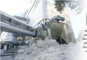  ??  ?? RIGHT
The towering aluminium T.rex sculpture is standing as guard in front of Central Embassy.