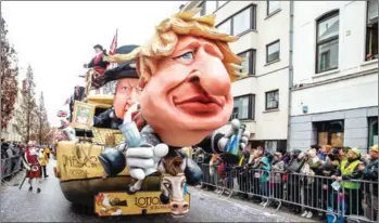  ?? AFP ?? A Brexit themed float fronted with a caricature of British Prime Minister Boris Johnson is pictured during the yearly carnival parade in the streets of Aalst, on February 23, 2020, starting with the so-called Zondagstoe­t.