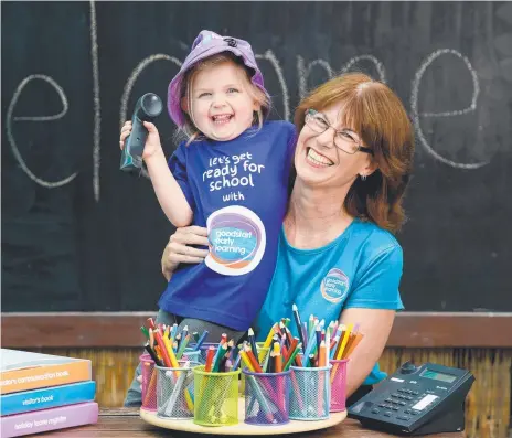  ?? Picture: Naomi Jellicoe ?? FIFTY’S JUST FINE: Suzanne Jeffries, a receptioni­st at Goodstart Early Learning Centre, with Hannah, 4.