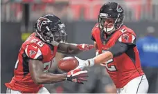  ?? DALE ZANINE, USA TODAY SPORTS ?? Reigning MVP Matt Ryan, right, is back for the Falcons, but can the team move past its Super Bowl collapse?