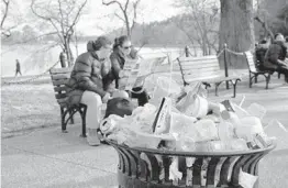  ?? JACQUELYN MARTIN/AP 2018 ?? A trash can outside the Martin Luther King Jr. Memorial in Washington. Expect to see fewer single-use plastic products in national parks across the country.