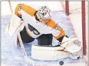  ?? FRANK GUNN — FOR THE CANADIAN PRESS ?? Flyers goaltender Carter Hart makes a save against the Tampa Bay Lightning during the second period of an Eastern Conference “seeding tourney” title game Saturday at Scotiabank Arena in Toronto.