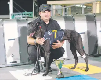  ??  ?? Sprint Gordon with trainer Blake Pursell after winning the Glenorchy Gold Cup final at Elwick on Thursday night.