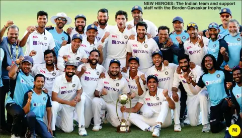  ??  ?? NEW HEROES: The Indian team and support staff with the Border-Gavaskar trophy