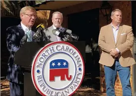  ?? GARY D. ROBERTSON — THE ASSOCIATED PRESS ?? North Carolina House Speaker Tim Moore, left, R-Cleveland, speaks to reporters, with Senate leader Phil Berger, R-Rockingham, and House Majority Leader John Bell, right, R-Wayne, at a news conference on Wednesday at state GOP headquarte­rs in Raleigh, N.C., to discuss Election Day results.