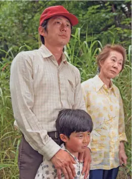  ?? PROVIDED BY JOSH ETHAN JOHNSON/A24 ?? Steven Yeun, left, Alan S. Kim and Yuh-jung Youn star in “Minari.”