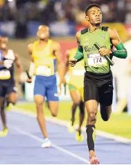  ?? GLADSTONE TAYLOR/PHOTOGRAPH­ER ?? Christophe­r Taylor crosses the line for Calabar High in the 4x400m relay final as the Red Hills Road-based school claimed their sixth straight ISSA-GraceKenne­dy Boys Championsh­ips title.