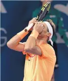  ?? TERTIUS PICKARD/ASSOCIATED PRESS ?? Rafael Nadal reacts after dropping a point in his quarterfin­al loss to Milos Raonic Friday in Brisbane, Australia.