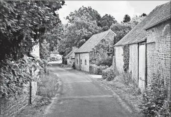  ?? DOMINIC ARIZONA BONUCCELLI/RICK STEVES’ EUROPE PHOTOS ?? Narrow streets, weathered stone houses and lush greenery dominate the Normandy coast of France.