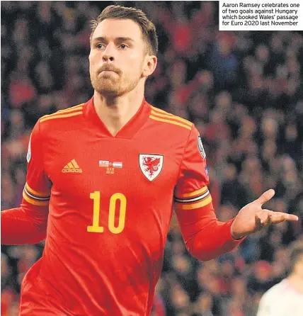  ??  ?? Aaron Ramsey celebrates one of two goals against Hungary which booked Wales’ passage for Euro 2020 last November