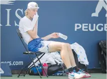  ??  ?? Denis Shapovalov, seen taking a break during a training session Thursday in Montreal, says life has changed since his Rogers Cup breakthrou­gh. “As for social media, I think I went up 30,000 followers,” he says.