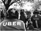  ?? PHOTO: REUTERS ?? Uber will take a 27.5 per cent stake in Grab