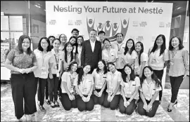  ??  ?? Nestle chairman and CEO Jacques Reber (center) and the NESTers.