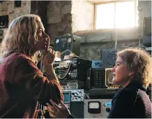  ?? PARAMOUNT PICTURES ?? Emily Blunt, left, and Millicent Simmonds are a mother and daughter who struggle to survive in the movie A Quiet Place.