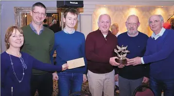  ??  ?? Maria Neilan and Tony Lyons presenting the Lions Club perpetual trophy to Declan McInerney’s team.