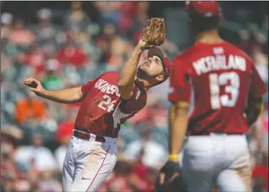  ?? NWA Democrat-Gazette/JASON IVESTER ?? HIGH FLYING: In this March 19 file photo, Arkansas third baseman Chad Spanberger fields a fly ball against Mississipp­i State at Baum Stadium in Fayettevil­le.