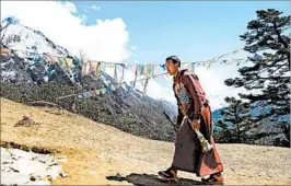  ?? PRAKASH MATHEMA/GETTY-AFP ?? A Nepalese monk heads toward the cremation site of climber Ueli Steck near Kathmandu last week. Steck was the first climber to die in the Himalayas this season.