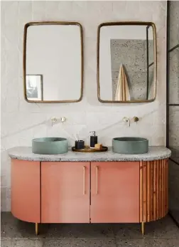  ??  ?? BATHROOM Terrazzo flooring has been used in both of the ensuite bathrooms, with the same mix used to create the slab for the vanity top. The terracotta and gentle green colours echo those used elsewhere in the house