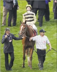  ?? Charlie Riedel / Associated Press ?? Country House and jockey Flavien Prat are led off the track after the Kentucky Derby Saturday at Churchill Downs in Louisville, Ky.