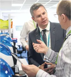  ?? Miller. Picture: Kris ?? Finance Secretary Derek Mackay talks to a staff member during a ministeria­l visit to Journeycal­l in Arbroath.