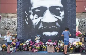  ?? JACK GRUBER/USA TODAY ?? The spot where Floyd died last summer became a memorial as a wave of protests for racial justice spread nationwide and across the world.