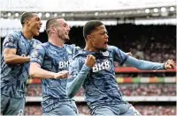  ?? /Mike Hewitt/Getty Images ?? Success: Aston Villa's Leon Bailey, right, celebrates scoring his team’s first goal against Arsenal with teammates John McGinn, centre, and Youri Tielemans.