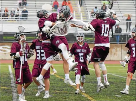  ?? AUSTIN HERTZOG — DIGITAL FIRST MEDIA ?? Garnet Valley’s Greg Reynolds, left, goalie Jason Rose, center, and Mitch Lachman kick off the celebratio­n Jaguars defeated Perkiomen Valley 8-7 in the District 1 Class 3A quarterfin­als Saturday at Phoenixvil­le. after the