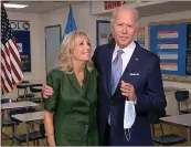  ??  ?? Biden joins wife, Jill, after her speech.