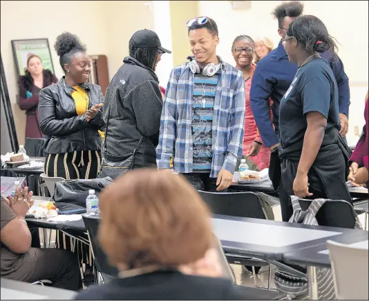  ?? KYLE TELECHAN/POST-TRIBUNE PHOTOS ?? Students from 21st Century Charter School stand up to be recognized during a news conference Thursday.