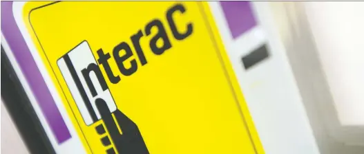  ?? JONATHAN HAYWARD/THE CANADIAN PRESS FILES ?? Interac Corp. saw 51.9 million Canadian e-transfers sent in March, the first time the 50-million mark has been crossed in a month.