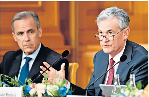  ??  ?? Jerome Powell, chairman of the US Fed, right, speaks as Mark Carney, Governor of the Bank of England, looks on at a conference to celebrate the 350th anniversar­y of the Riksbank