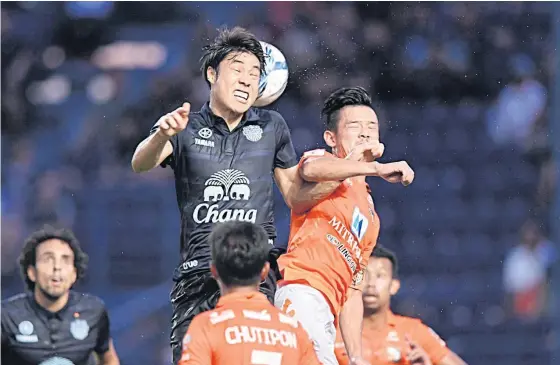  ??  ?? Buriram’s Go Seul-Ki, left, in action against Ratchaburi last week.