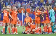  ?? AP PHOTO/LAURENT CIPRIANI ?? Members of the Netherland­s’ national women’s soccer team celebrate after winning their World Cup semifinal against Sweden 2-1 in extra time on Wednesday at Stade de Lyon in France.