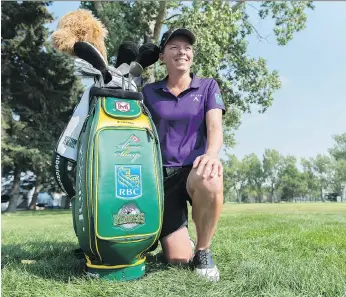 ?? MICHAEL BELL/THE CANADIAN PRESS ?? “This is another way to let the families know they aren’t forgotten,” says Alena Sharp of her green-and-gold golf bag honouring the Humboldt Broncos.