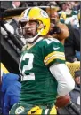  ?? (AP/Kamil Krzaczynsk­i) ?? Green Bay Packers quarterbac­k Aaron Rodgers celebrates after scoring a touchdown in the Packers’ 36-28 victory over the Los Angeles Rams on Sunday at Lambeau Field in Green Bay, Wis.