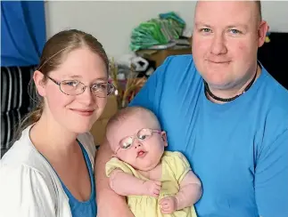  ?? PHOTO: SCOTT HAMMOND/FAIRFAX NZ ?? A family with new hope: mother Samantha, Catherine and father Nigel Pilcher.