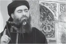  ?? MILITANT VIDEO/ THE ASSOCIATED PRESS ?? The leader of the Islamic State group, Abu Bakr al-Baghdadi declared himself the leader of the world’s Muslims and ordered his fighters to attack the Yazidis in their homes.