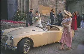  ?? (AP/Emilio Morenatti) ?? Newlyweds and guests leave the church during a wedding in Barcelona, Spain.