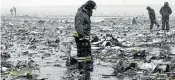  ?? Picture: EPA ?? IN RUINS: Firefighte­rs search for the flight recorders of a Flydubai Boeing 737-800 at Rostov-onDon Airport in Russia