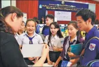  ?? XINHUA ?? University students take part in an education expo held on March 24 in Vientiane, Laos.