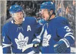  ?? CLAUS ANDERSEN GETTY IMAGES ?? Auston Matthews, right, started the Leafs’ comeback from a 3-0 deficit with a second-period power-play goal.