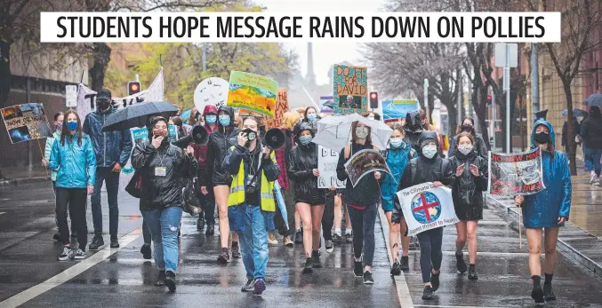  ?? Picture: Chris Kidd ?? Students and supporters march through the city for the Hobart School Strike for Climate Change.