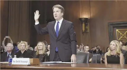  ?? AP PHOTO ?? COMING OUT SWINGING: Supreme court nominee Brett Kavanaugh is sworn in to testify before the Senate Judiciary Committee on Capitol Hill yesterday.