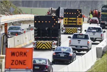  ?? BEN HASTY — MEDIANEWS GROUP ?? Vehicles are directed into the right lane on Interstate 78in Greenwich Township Tuesday morning. Transporta­tion and law enforcemen­t officials reminded motorists to drive safely in constructi­on zones.
