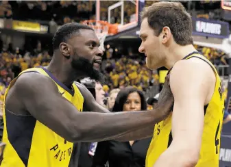  ?? Darron Cummings / Associated Press ?? Indiana’s Lance Stephenson (left) celebrates with Bojan Bogdanovic after the Pacers beat the Cavaliers to take a 2-1 lead in their first-round playoff series. Bogdanovic scored 30 points.