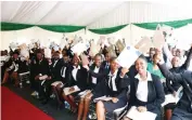  ?? - Pictures: John Manzongo ?? The 100 students jubilantly display the scholarshi­ps they received from United Nations Tourism through Angel of Hope Foundation patron First Lady Dr Auxillia Mnangagwa at Zimbabwe House yesterday.